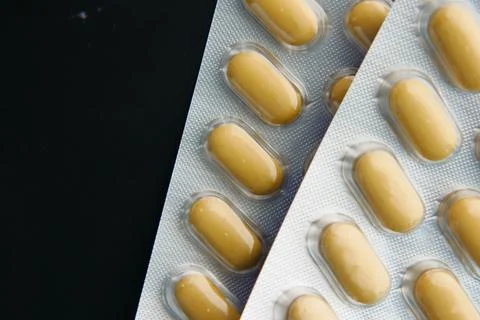 Close up of pills of blister pack on table Stock Photos