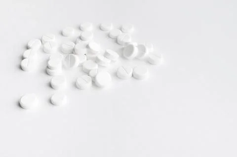 Close-up pills lying on the table Stock Photos