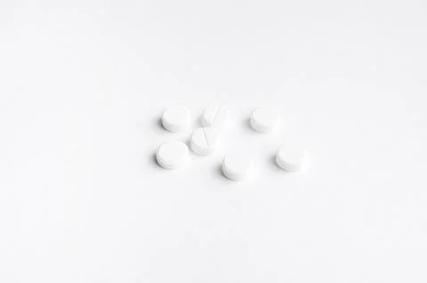 Close-up pills lying on the table Stock Photos