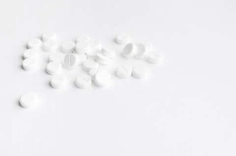 Close-up pills lying on the table Stock Photos