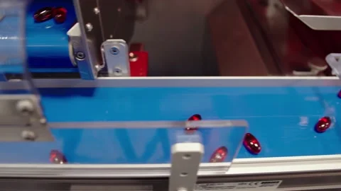 The close-up of pills moving along the assembly line. the pharmaceutical Video stock 199684809