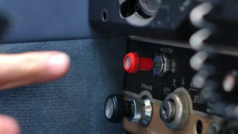 Close Up Pilot Actuating Master Switch in Airplane Cockpit - Push Pull Stock Footage 305543698
