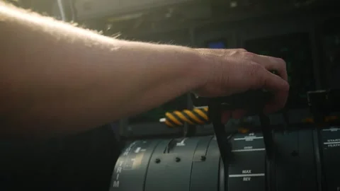 Close Up of Pilot Hand Adjusting Engine Power Levers in Flight Stock Footage 331568632
