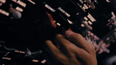 Close-Up of Pilot Hand Turning On Cockpit Power Systems Stock Footage 326178817