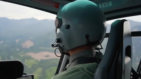 Close-up of Pilot in a Helicopter over Beautiful Landscape in Vancouver, Canada Stock Footage 113942649