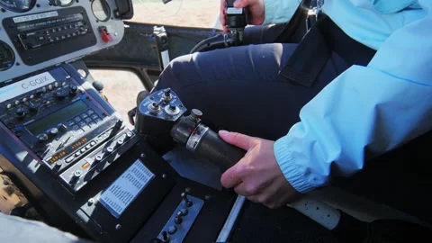 Close-up of a pilot pulling the lever to fly the helicopter. Stock Footage 294533641