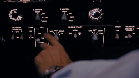 Close-Up of Pilot's Hands Operating Simulator Switches and Buttons Stock Footage 326180073