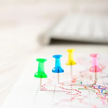 Close up of pin on graph data. Finance concept Stock Photos