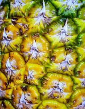 Close up pineapple flesh surface showing natural tropical fruit texture and.. Stock Photos