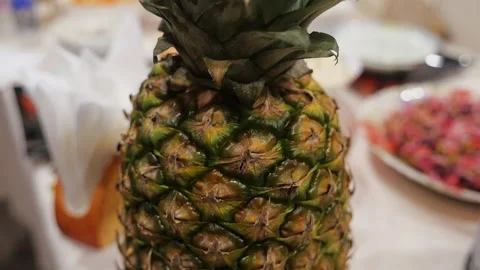 Close-up of pineapple on the kitchen table camera movement from bottom to top Stock Footage 146768041