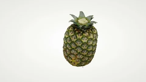 Close up of pineapple rotating seamless loop against white Stock Footage 111392211