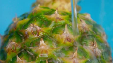 Close up of pineapple running water texture background. Fruit food background Stock Footage 169624188