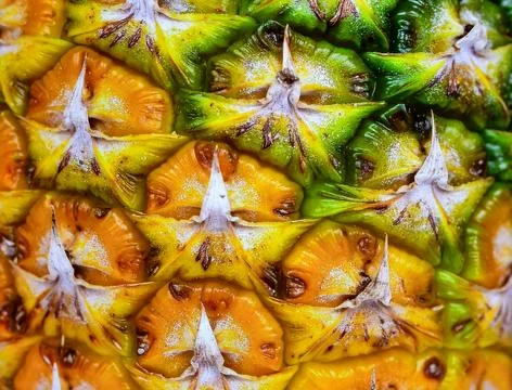 Close up pineapple skin surface showing tropical fruit texture and organic .. Stock Photos