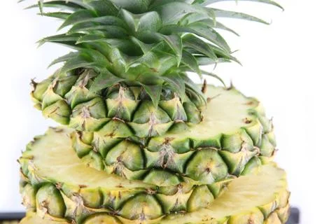 Close-up pineapple slices stacked. Stock Photos