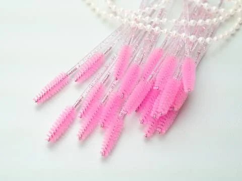 Close up of pink brushes for combing eyelash extensions and brows Stock Photos