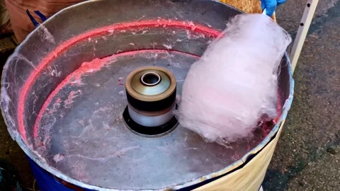 Close-up Of Pink Cotton Candy Being Spun And Collected In A Large, Metallic Stock Footage 318201774