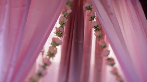 Close-up of pink curtains adorned with delicate roses Stock Footage 316301751