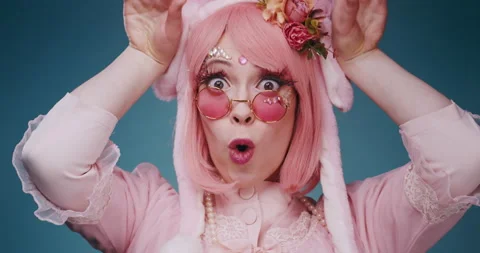 Close up of pink cute candy anime girl with rabbit ears and pink sunglasses make Stock-Footage 156860631