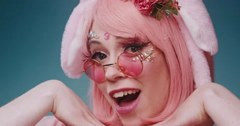 Close up of pink cute candy anime girl with rabbit ears and pink sunglasses make Stock-Footage 156861832