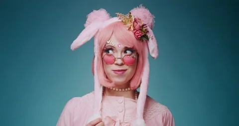 Close up of pink cute candy anime girl with rabbit ears and pink sunglasses make Stock-Footage 156862185