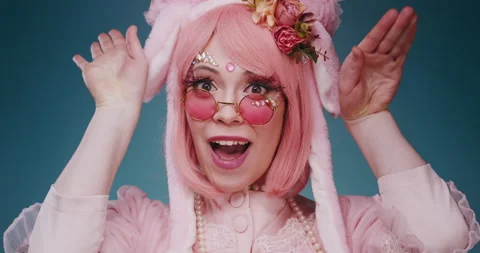 Close up of pink cute candy anime girl with rabbit ears and pink sunglasses make Stock-Footage 156897394