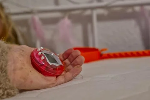 Close-up of a Pink Digital Timer on a Bed Stock Photos