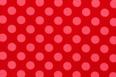 Close up of pink dot red background fabric. Stock Photos