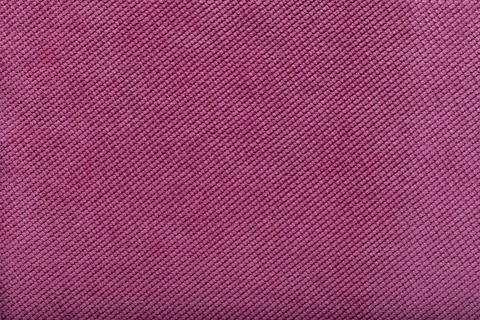 Close-up of pink fabric surface, small stitches as background Stock Photos