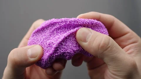 Close-Up of Pink Floam Slime Pulled by Hands for ASMR Sensation Stock Footage 311839967