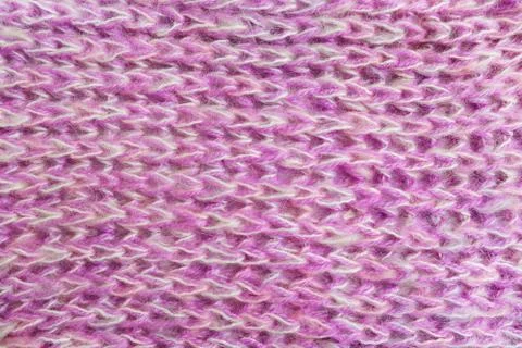 Close up of pink knitted wool texture. Stock Photos