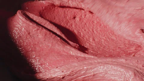 Close up of a pink liquid mass, baking a cake. Stock Footage 149124020