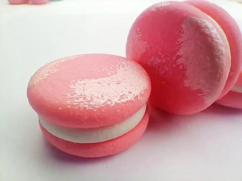 Close up of pink macarons on white background Stock Photos