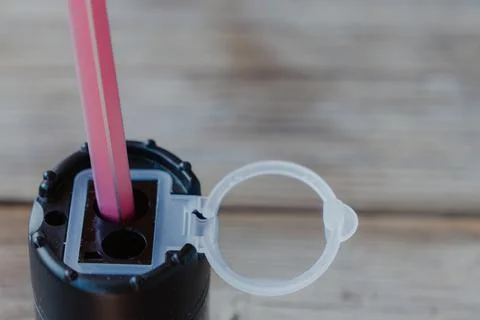 Close-up of a pink pencil inserted into a black rotary pencil. Stock Photos