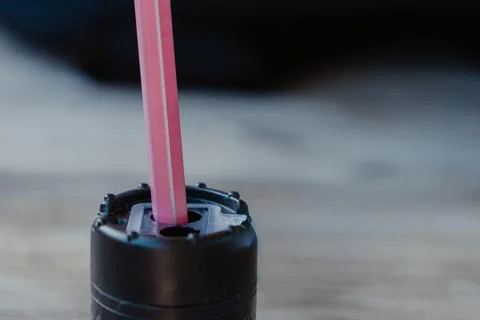 Close-up of a pink pencil inserted into a black rotary pencil. Stock Photos
