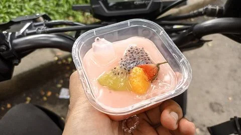 Close up pink pudding with sliced fruit Stock Photos