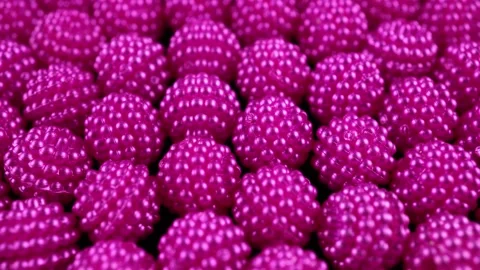 Close Up Of Pink Raspberry Textured Beads. Stock Footage 305403899