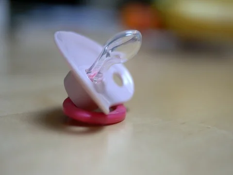 Close-up of pink soother dummy Stock Footage 80642917