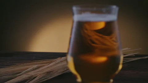 Close-up of a pint of beer, an amber drink is poured and smoke Stock Footage 131065281