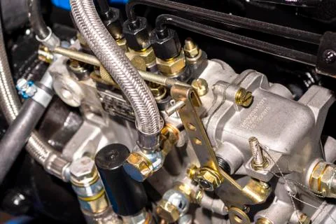 Close up of pipe system of hydraulic valves in agricultural machinery Stock Photos