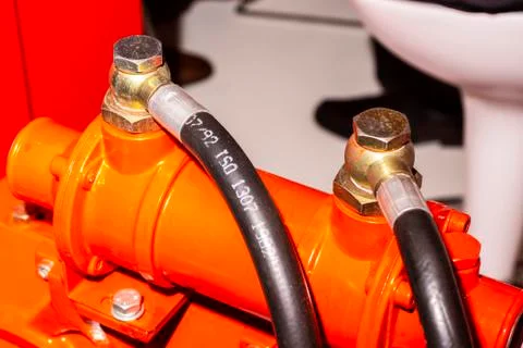 Close up of pipe system of hydraulic valves in agricultural machinery Stock Photos