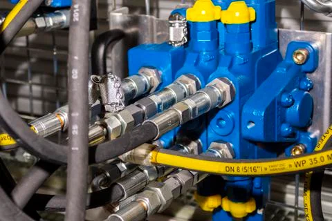 Close up of pipe system of hydraulic valves in agricultural machinery Stock Photos