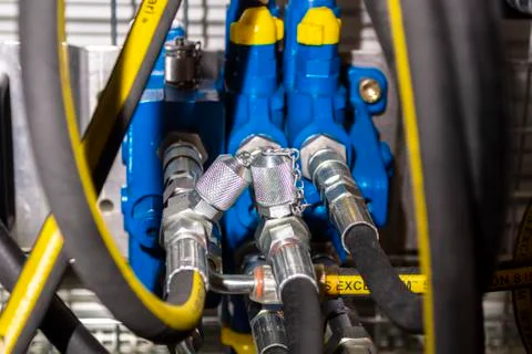 Close up of pipe system of hydraulic valves in agricultural machinery Stock Photos