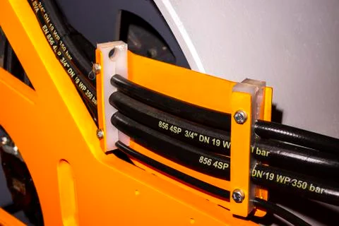 Close up of pipe system of hydraulic valves in agricultural machinery Stock Photos