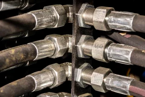 Close up of pipe system of hydraulic valves in agricultural machinery Stock Photos
