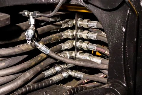 Close up of pipe system of hydraulic valves in agricultural machinery Stock Photos
