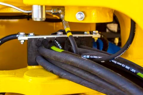 Close up of pipe system of hydraulic valves in agricultural machinery Stock Photos