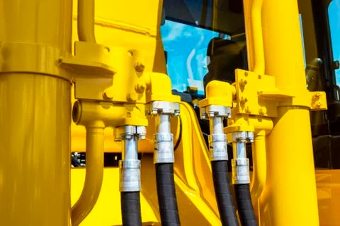Close up of pipe system of hydraulic valves in agricultural machinery Stock Photos