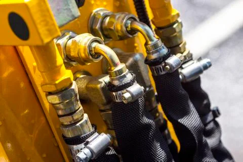 Close up of pipe system of hydraulic valves in agricultural machinery Stock Photos