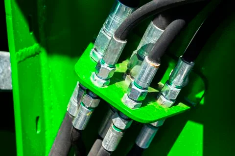 Close up of pipe system of hydraulic valves in agricultural machinery Stock Photos