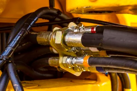Close up of pipe system of hydraulic valves in agricultural machinery Stock Photos